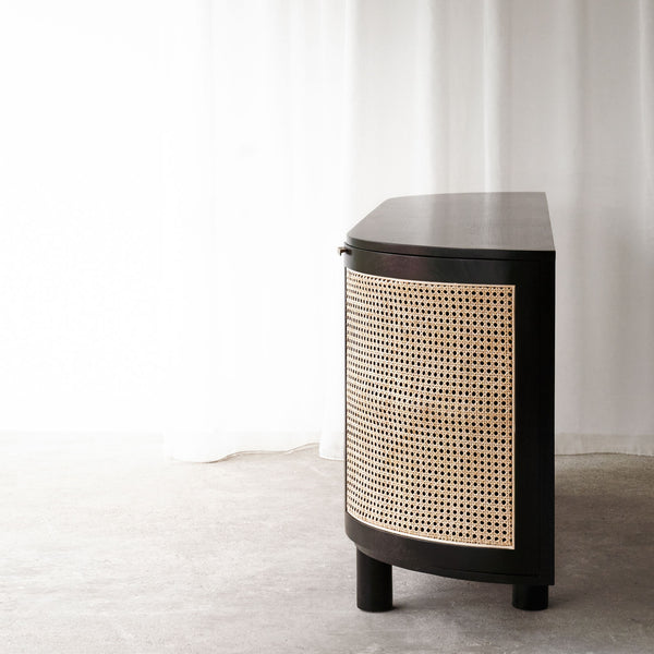 Naumi teak rattan sideboard black with rattan inlay crafted with sustainably sourced teak and fixed shelves - $3280